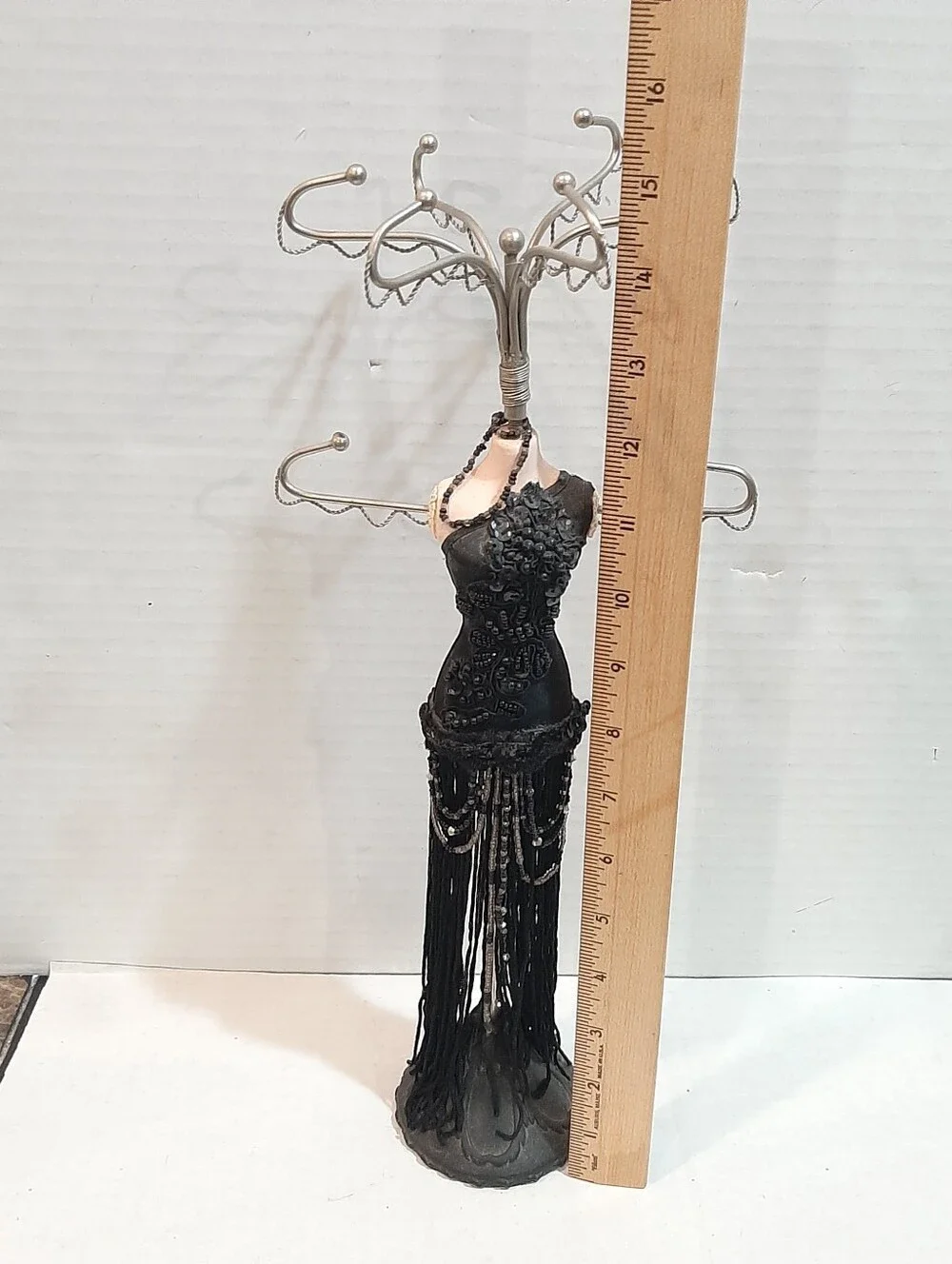 Black fringed flapper dress jewelry display stand